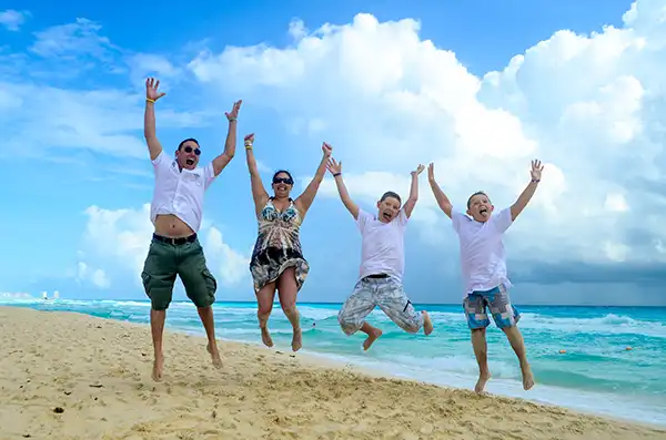 family enjoying the beach