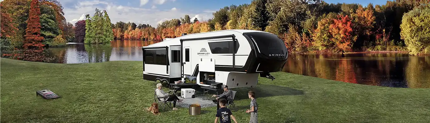 Brinkley RV with campers by lake